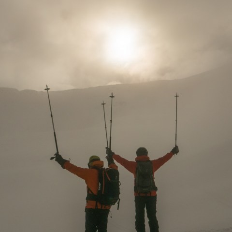 a man is cross country skiing in the snow